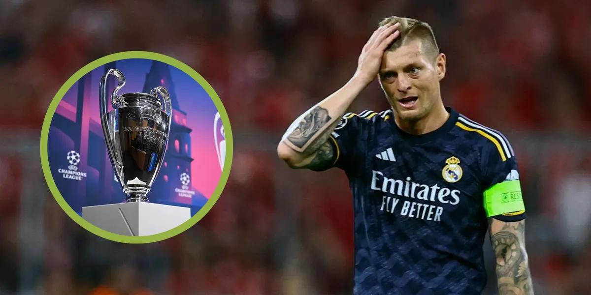 Kroos con la camiseta del Real Madrid con la Champions a su derecha.